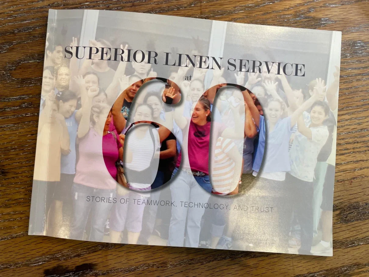 Superior Linen Service's 60-year anniversary book comes to life in the stories and voices of its employees.