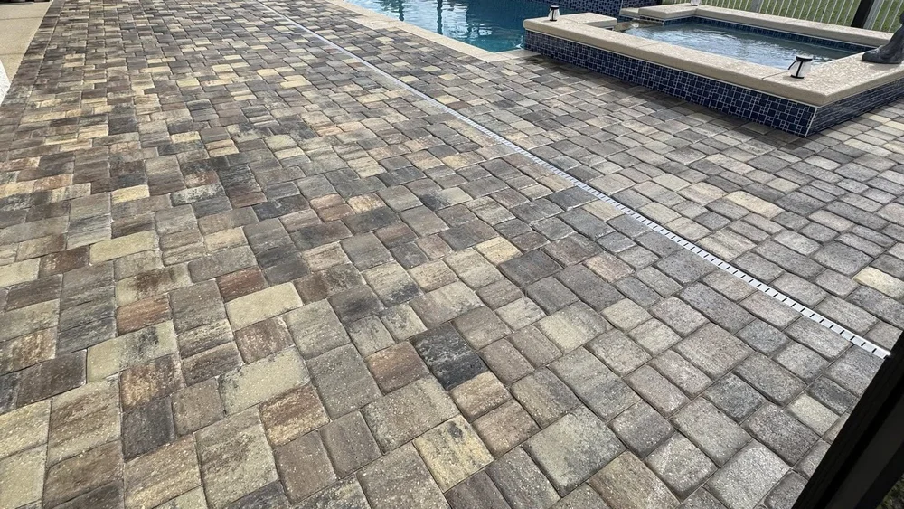 Freshly sealed paver pool deck in Marion County