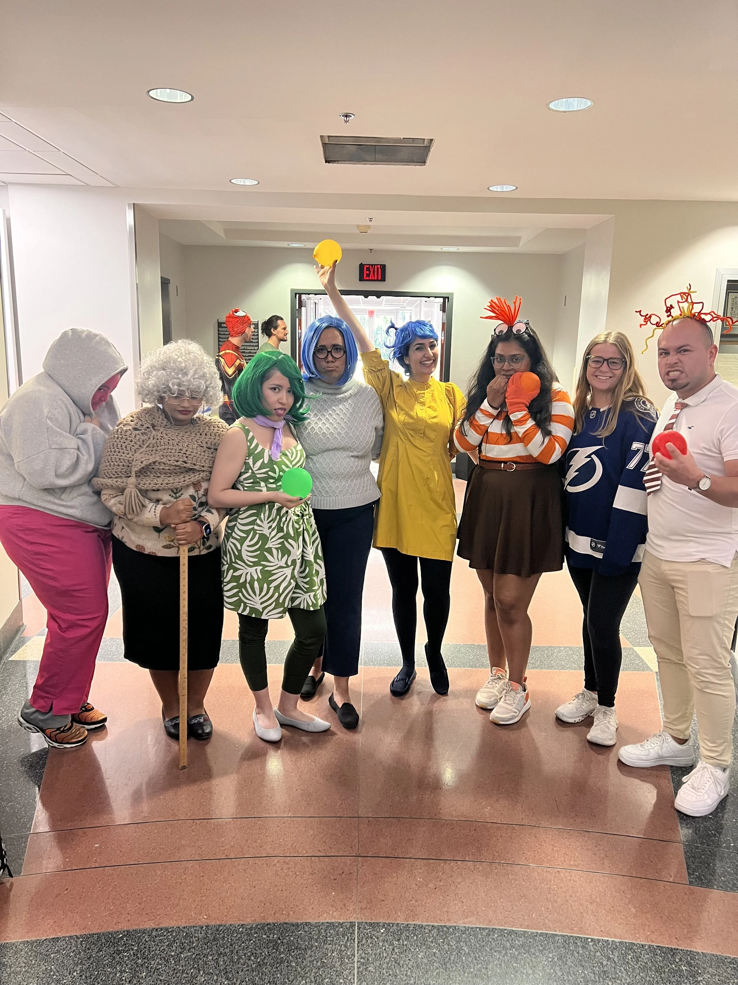 Lab members dressed as characters from Inside Out during a fun Halloween costume event.