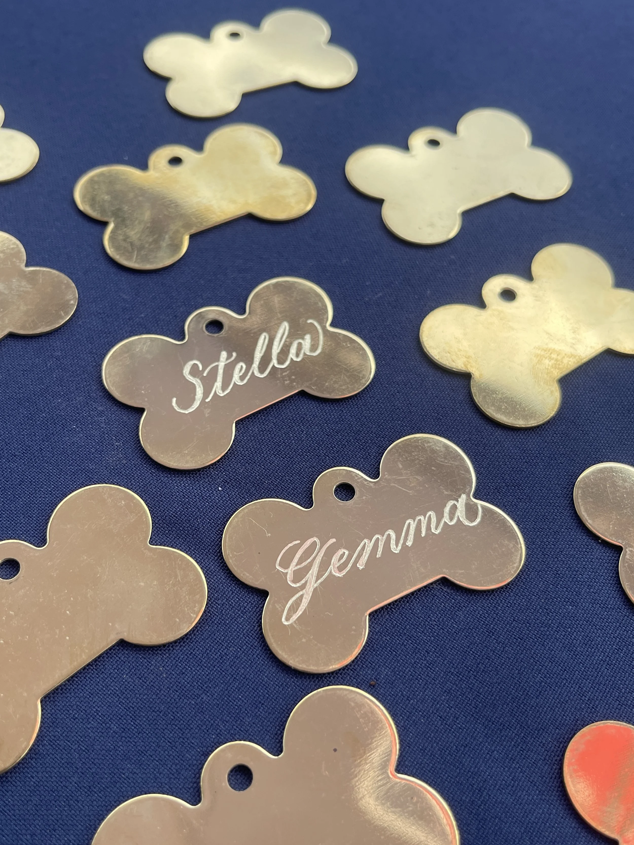 Hand engraved dog tags, Missouri Live Event Calligrapher and engraver