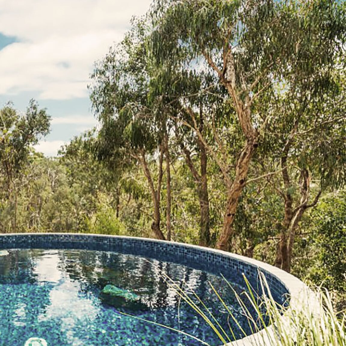 &bull; Warrandyte &bull; This project makes a stunning statement and maximises the available space with a circular plunge pool. 

We repeated the pool shape throughout the landscape and the use of a cohesive blend of natural materials, including rock