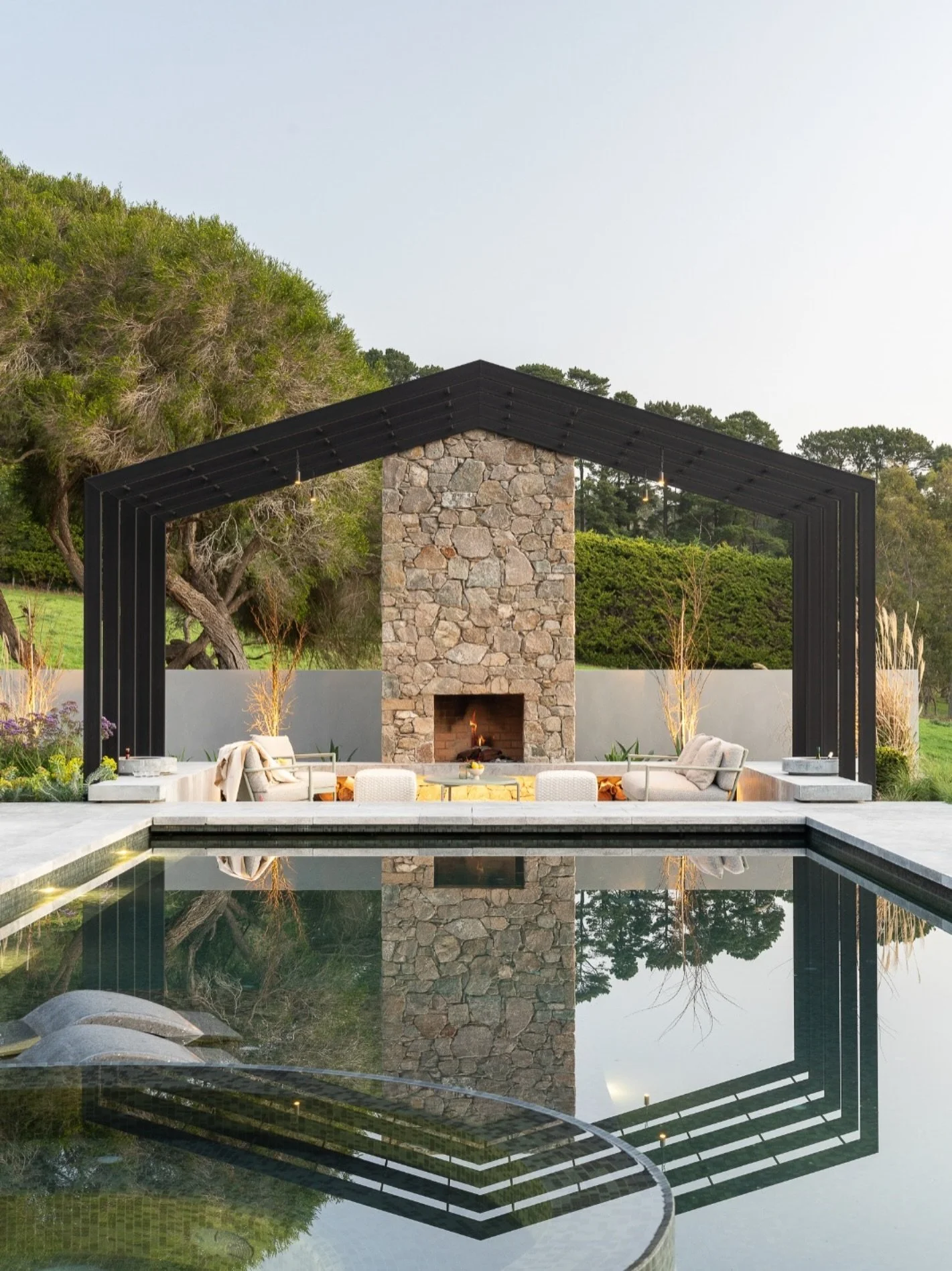 Behind every seamless pool is a story of problem-solving. Red Hill is one of our favourites.

Old tree roots, unstable fill and even mains power running through the dig meant the project started with some serious hurdles. Strip footings and re-routed