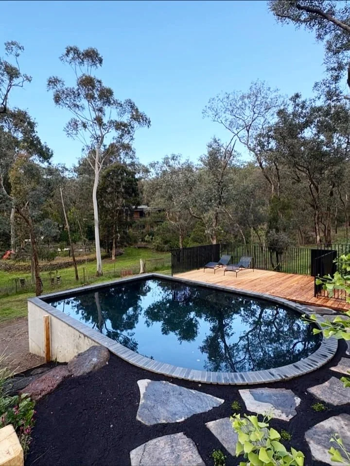 There&rsquo;s something special about this one, the way the custom shape settles into the landscape and the surface mirrors the canopy above. A pool designed to feel part of the bush, not imposed on it.

That reflection, that curve, that calm.
Resear