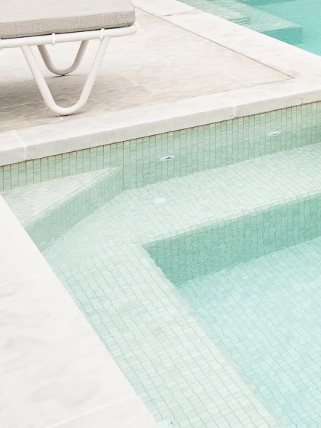 This water colour gets a lot of attention.

A pale tile with just enough movement through the surface to keep the pool feeling light, clear and glassy.

The finish here is Luna, shown in our Surrey Hills project. 

Pool by @tlc_pools with @remcopoolc