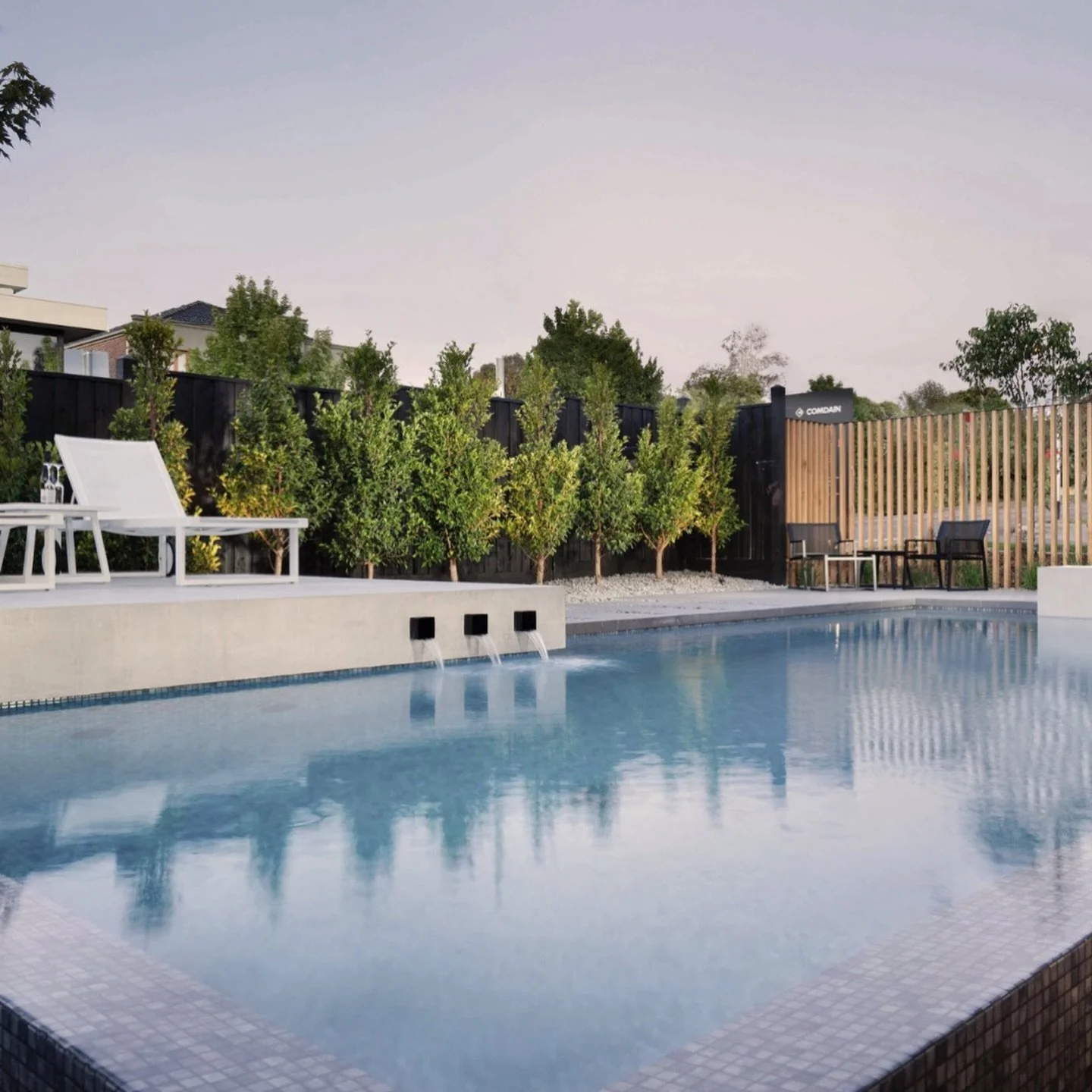 This Surrey Hills pool is designed to sit within the architecture, not beside it.

The waterline is held tight to the house, with levels aligned so the pool reads as an extension of the living space.

A refined material palette keeps the focus on for