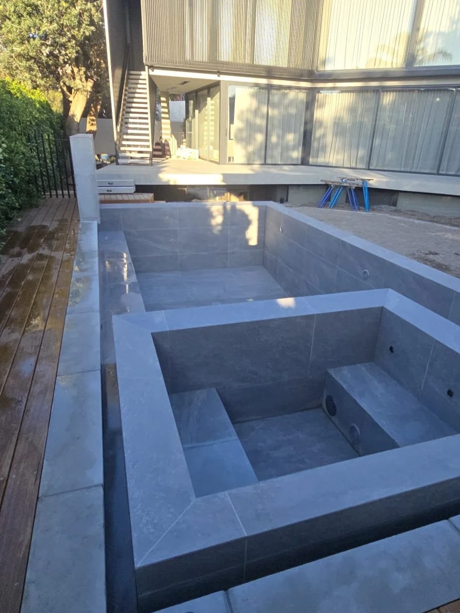 Beaumaris, just before fill.

Large format tiles shift the whole read of a pool. Fewer joins, longer lines and a surface that feels carved rather than pieced together.

Eco Technifirma 1220 &times; 600 tiles from @ecooutdoor set that direction early.