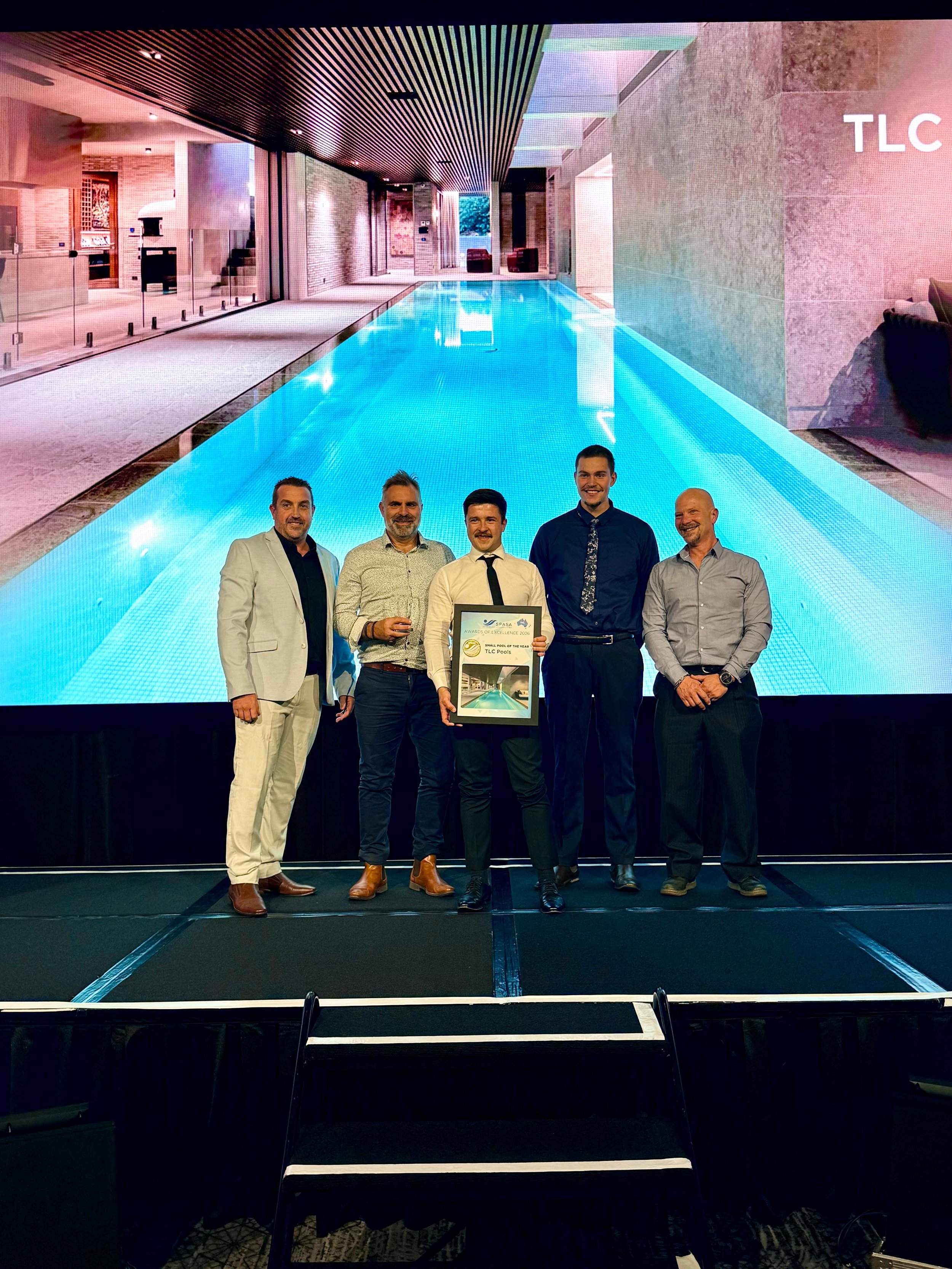 TLC Team accepting Best Indoor Pool Award