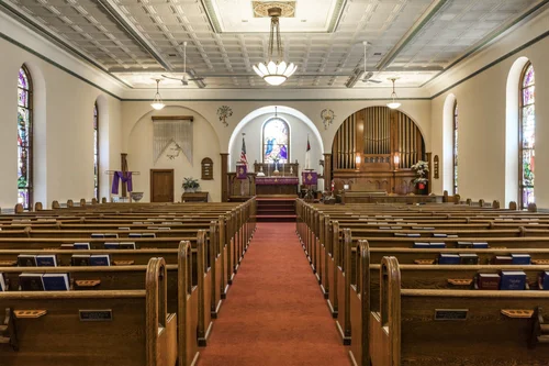 The empty sanctuary, looking down the aisle to the pulpit