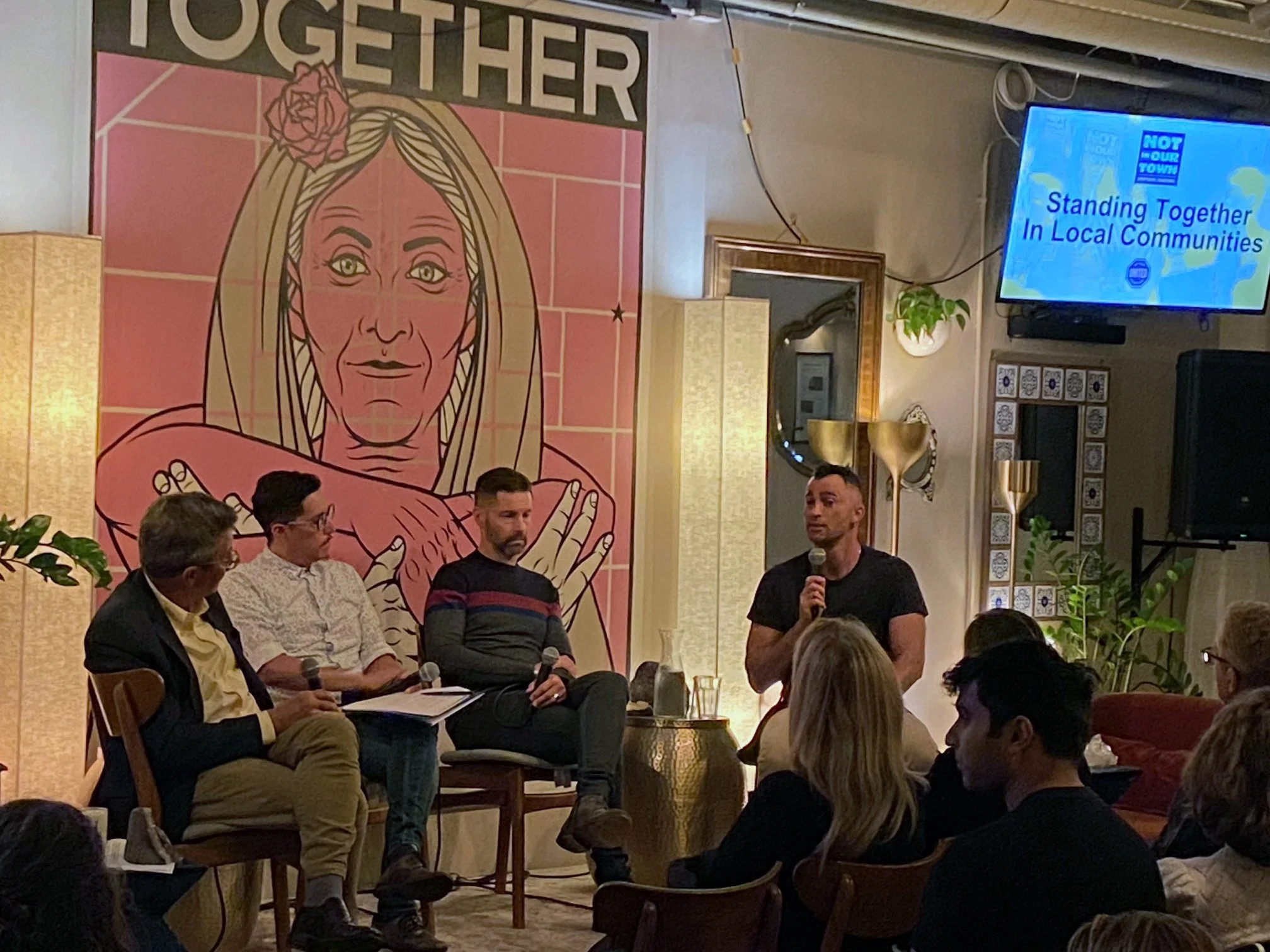 San Francisco civic entrepreneur Manny Yekutiel leads a panel discussion on how to have hard conversations at a United Against Hate Week event co-sponsored by Not In Our Town.