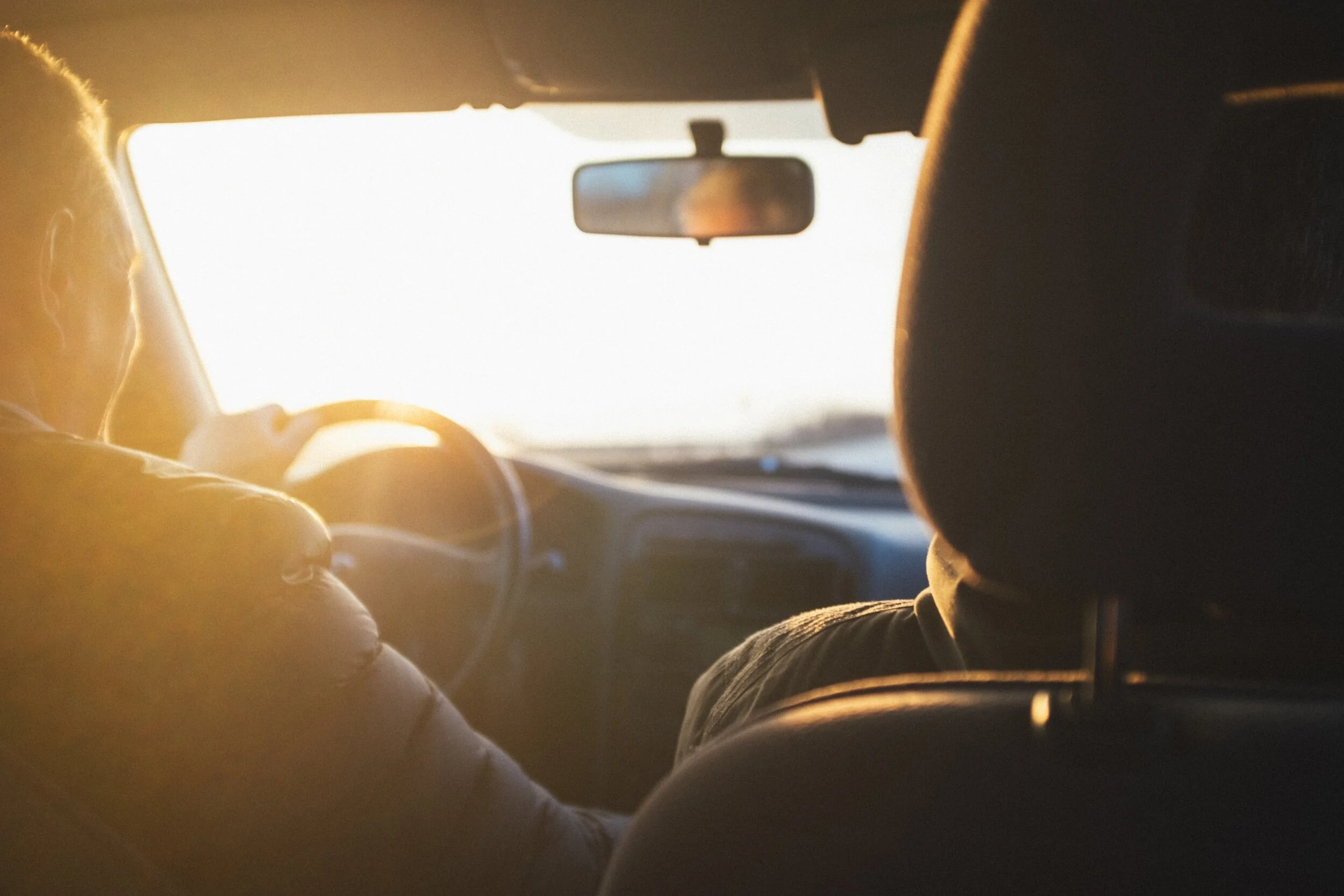 Person driving in car with motion sickness