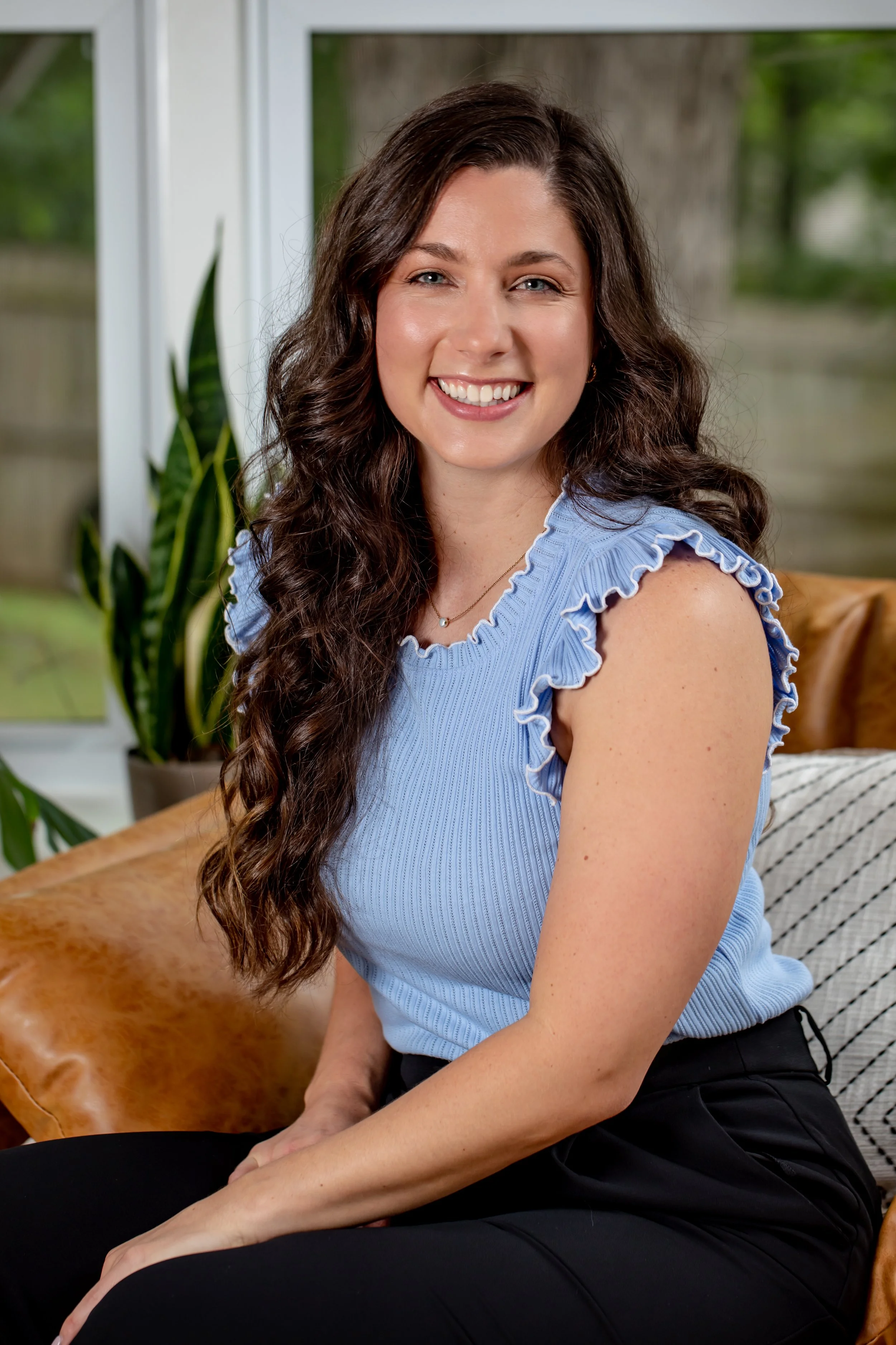 Professional headshot of Adrienne Blaj, vestibular physical therapist and co-owner of Rebalance Physical Therapy