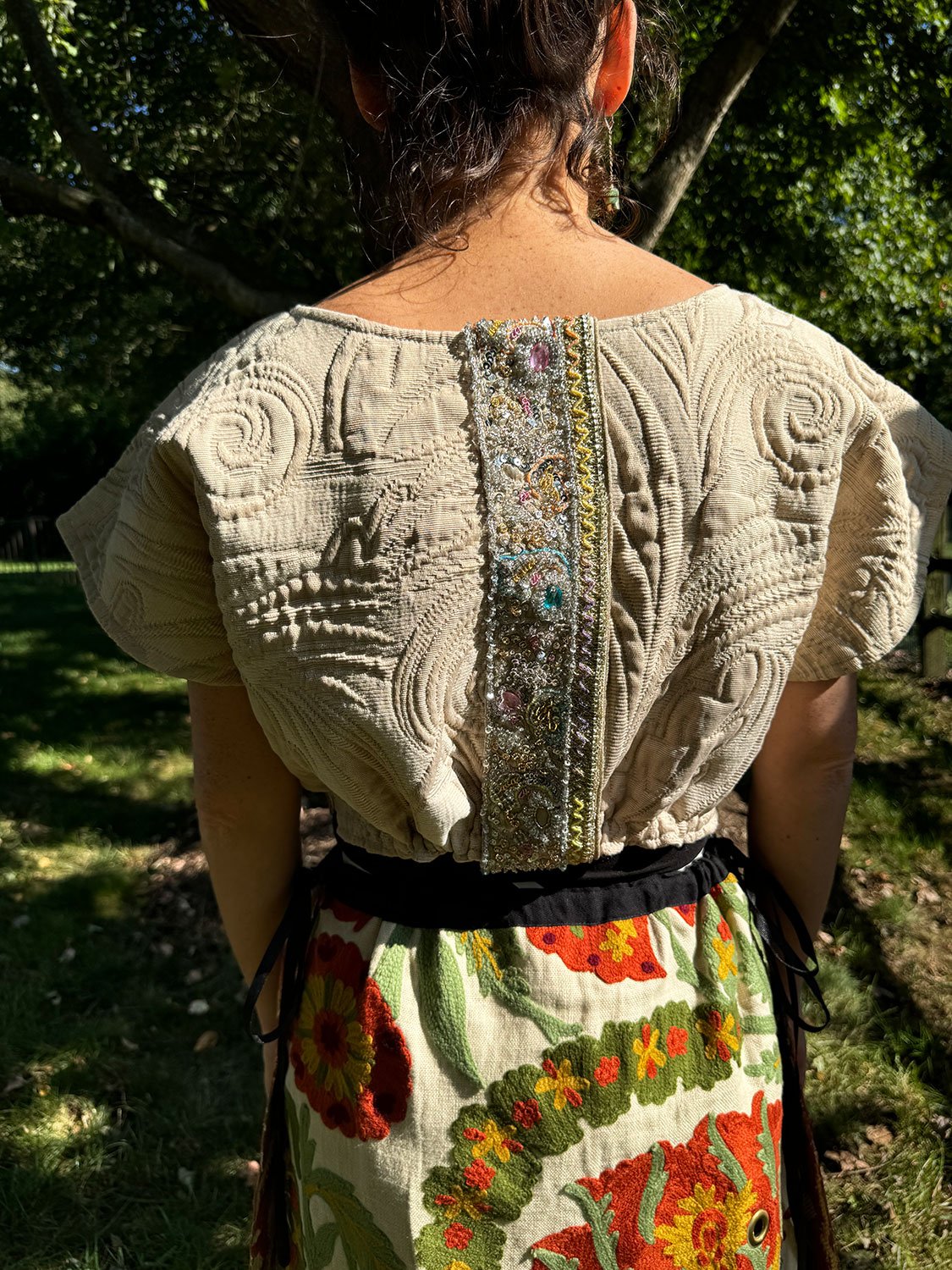 Frida Capelet with antique Sari fragment panels worn reversed on back on model close up