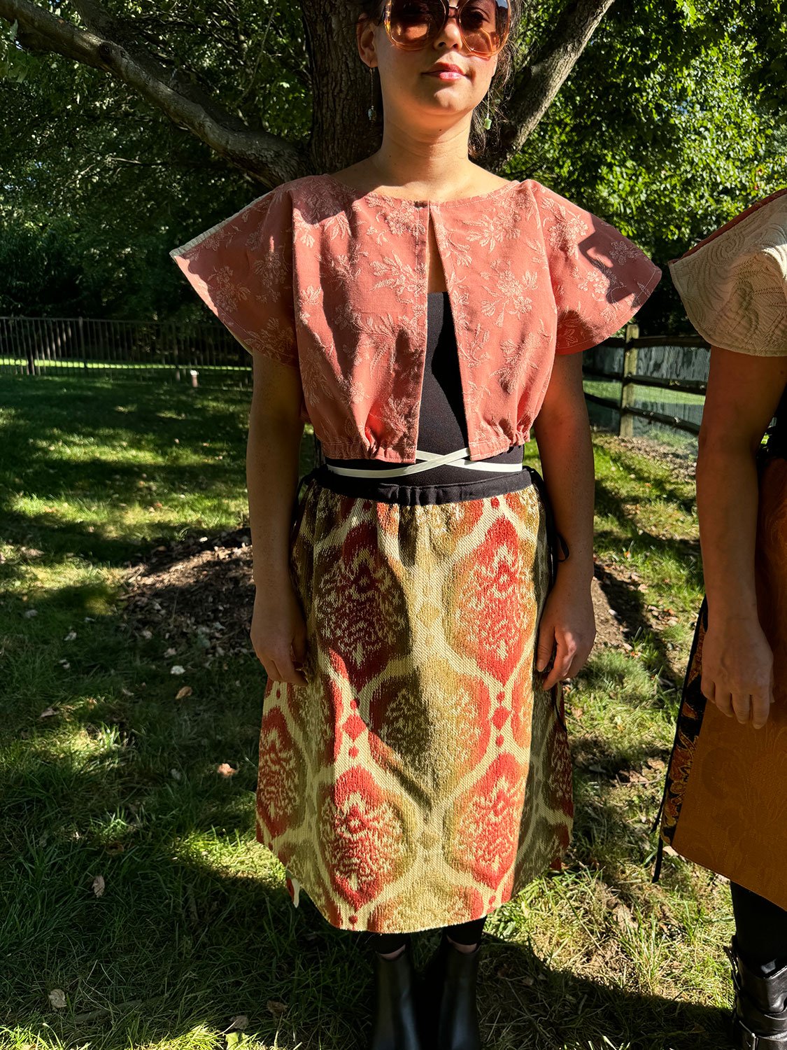 Frida Capelet worn reversed on model front view with Piper skirts/dress/cape worn