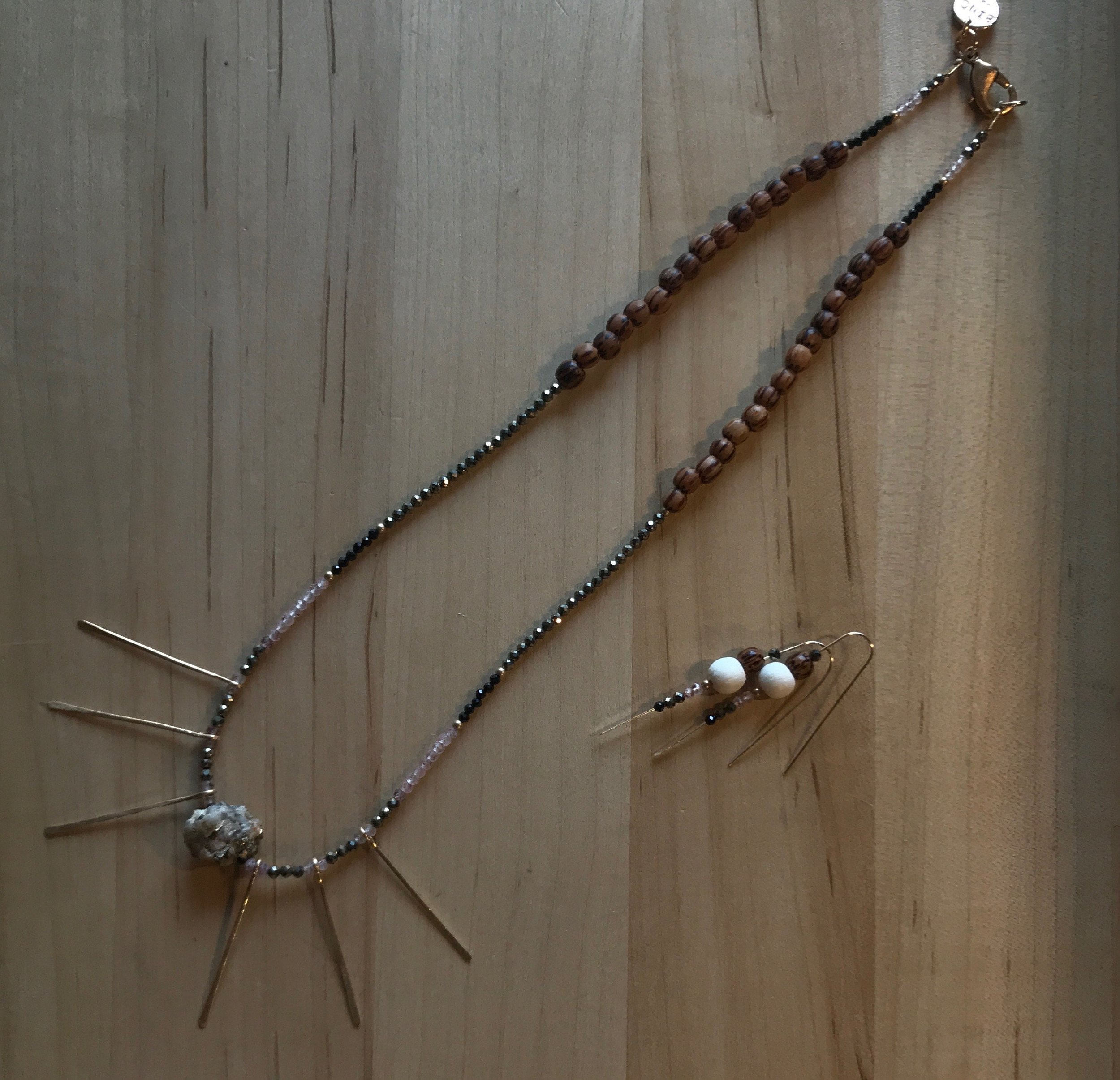 ASTRID Necklace Laying On Table