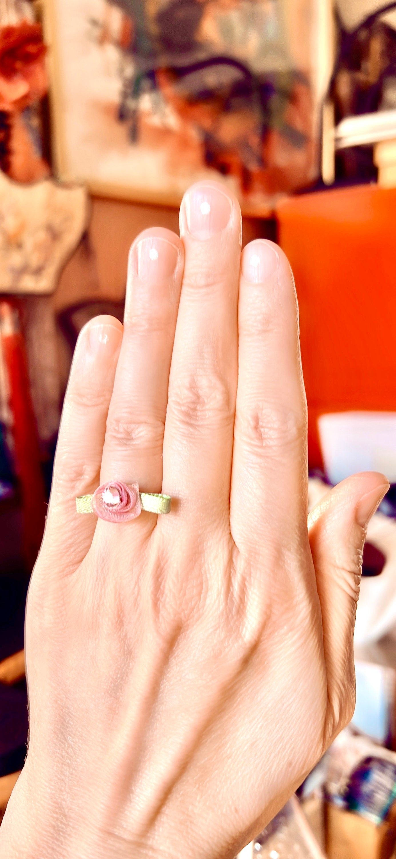 FLOWER CHILD Flower Toe Or Finger Ring On Finger Close Up View