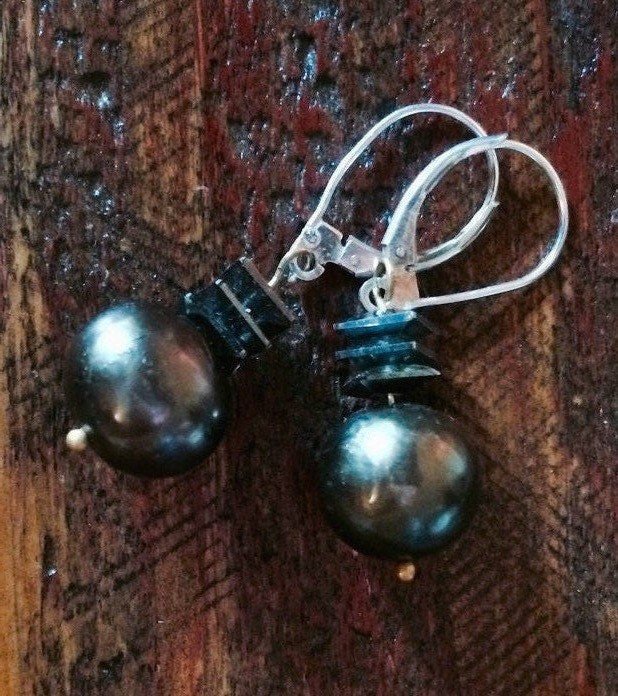 AVA Earrings Laying On Table