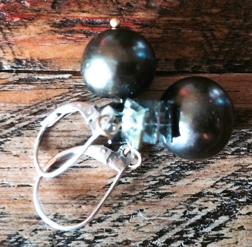 AVA Earrings On Table Angle View