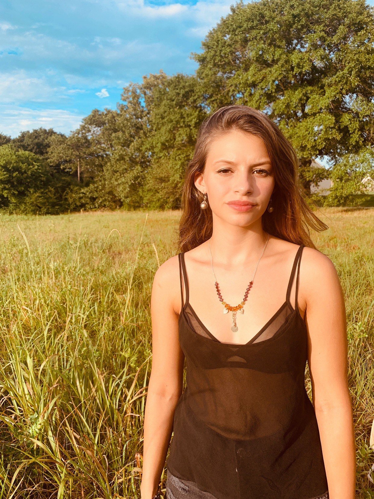 SAWYER Flutter Earrings Model Wearing From A Distance