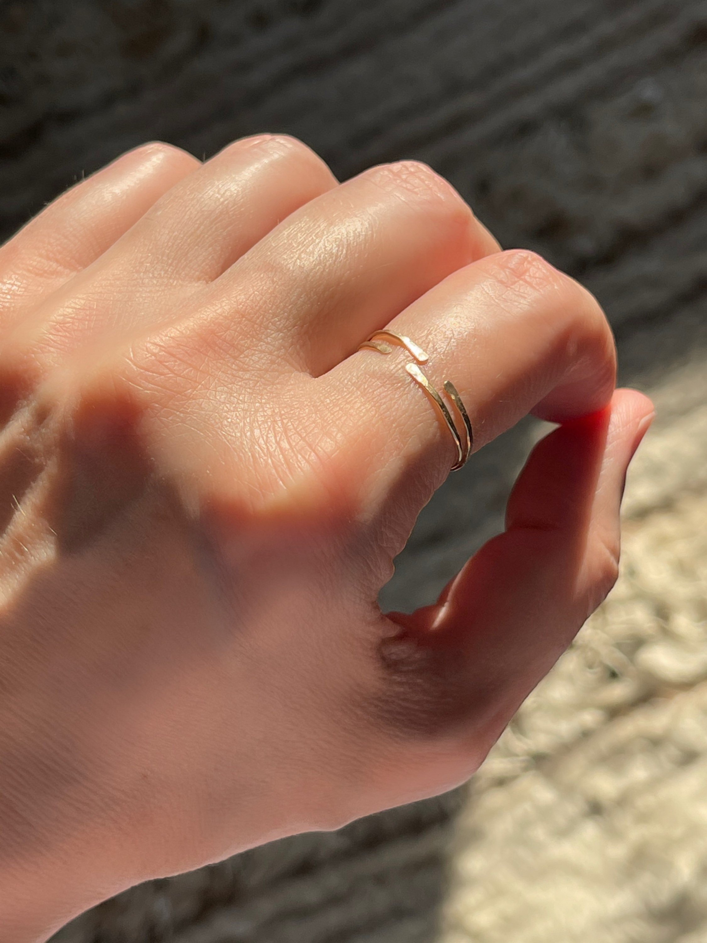 KAI Split Ring Model Wearing On Finger Angle View