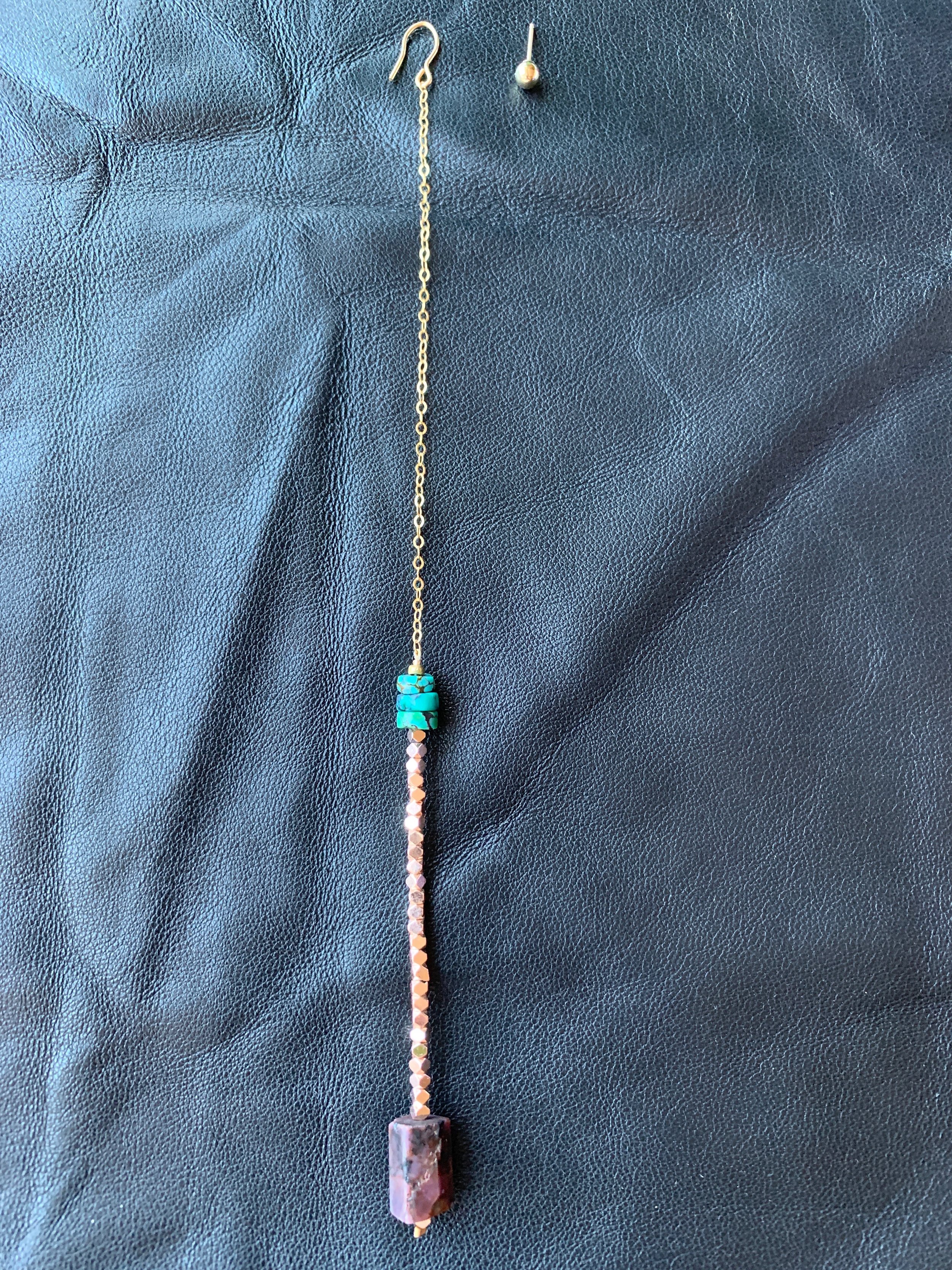 GENEVIEVE Earring Hanging On Display
