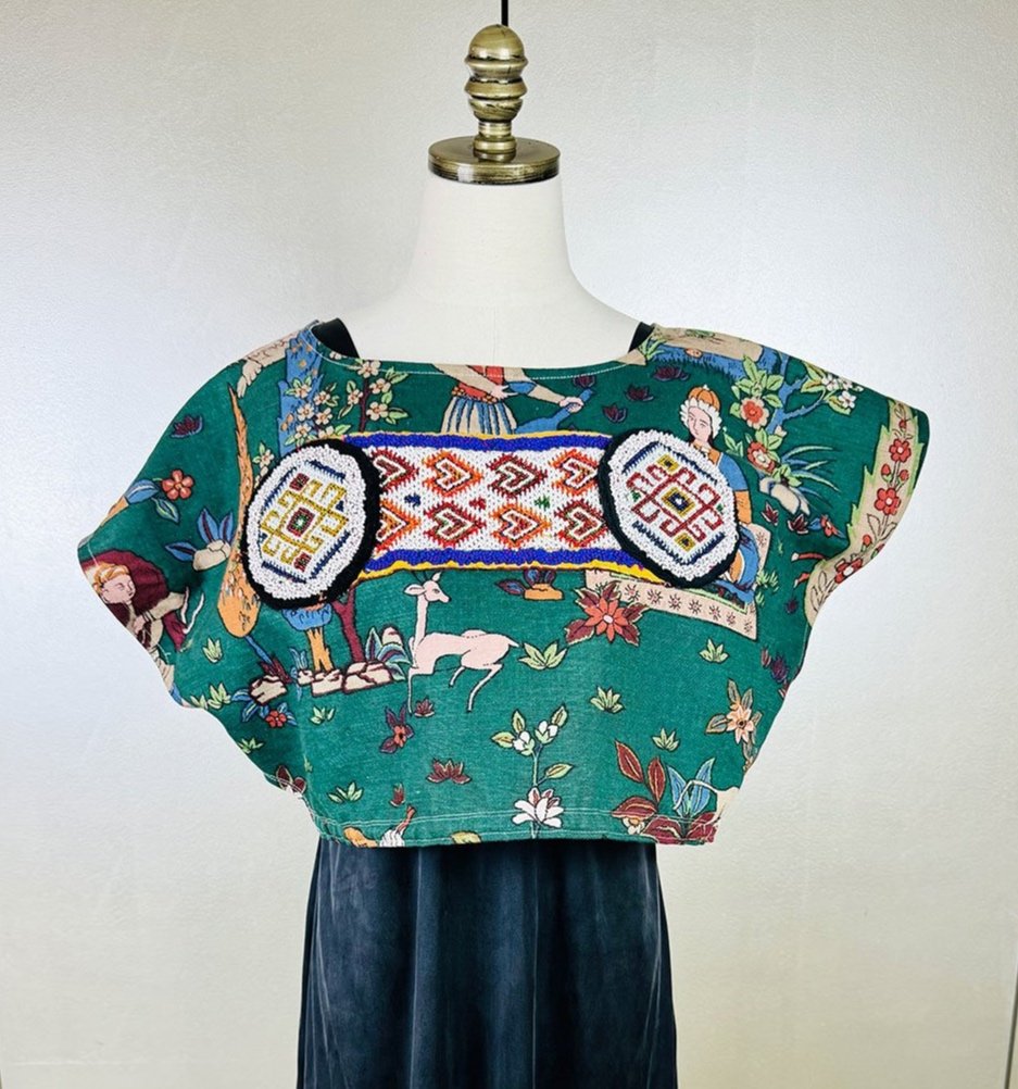 Frida Capelet shown with antique beaded deconstructed tribal panel on mannequin