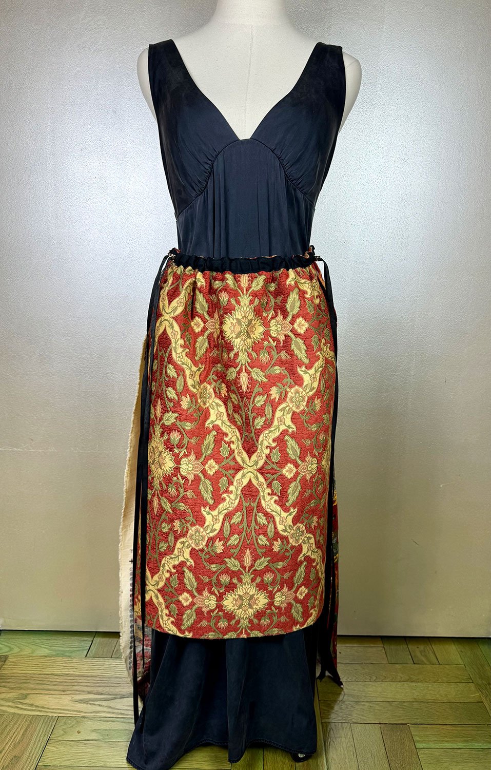 Piper overskirt on mannequin worn reversed with long ribbon detail