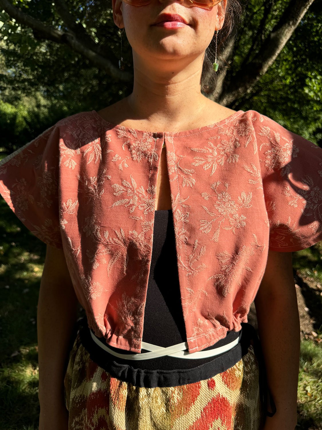 Frida Capelet worn reversed on model front view close up