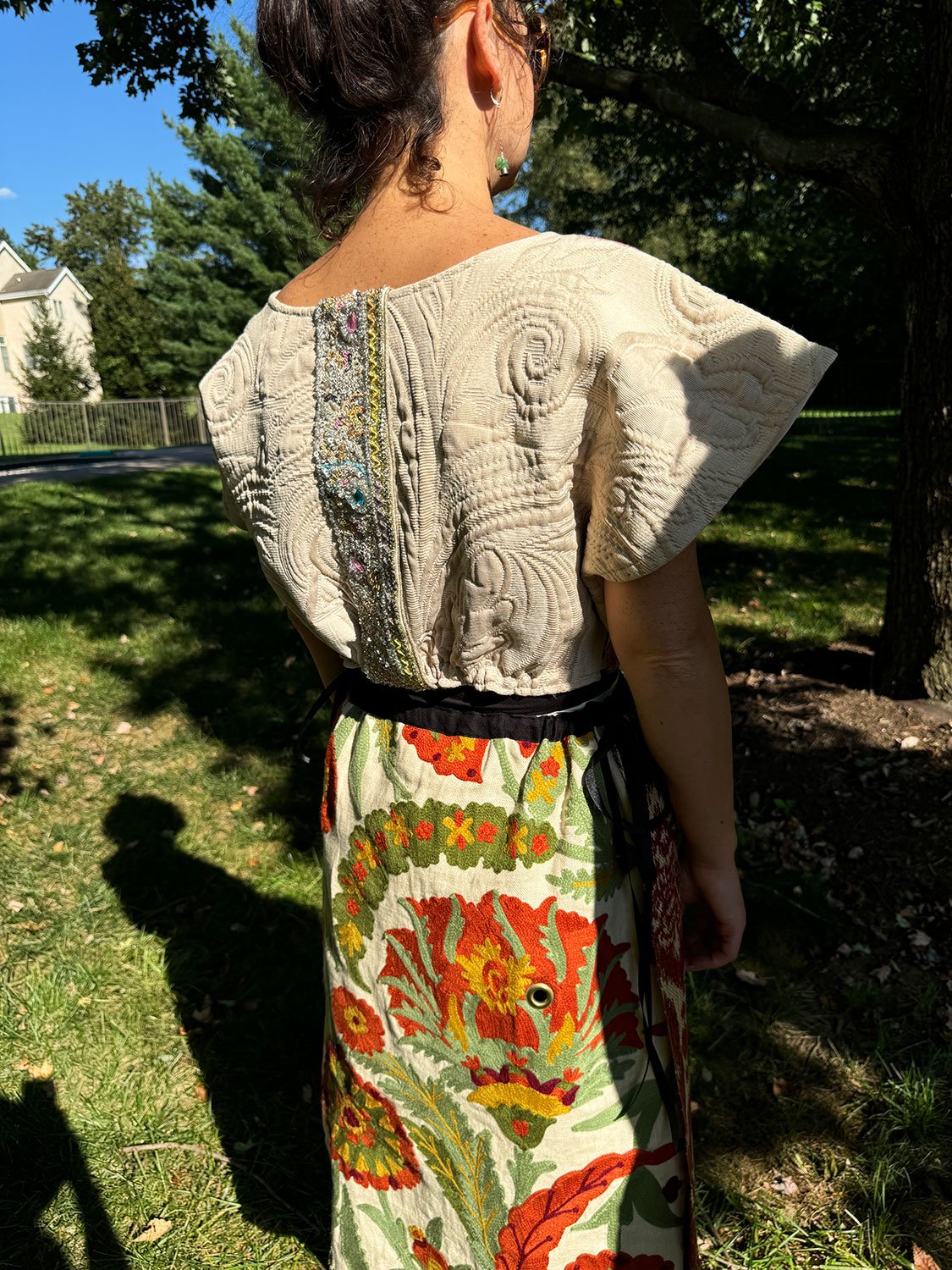 Piper overskirt on model back view shown with Frida overcoat