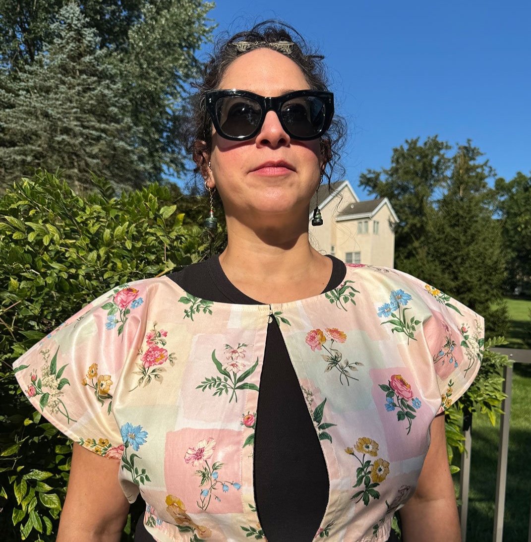 Frida Capelet pink coated chintz print reversed worn open on model