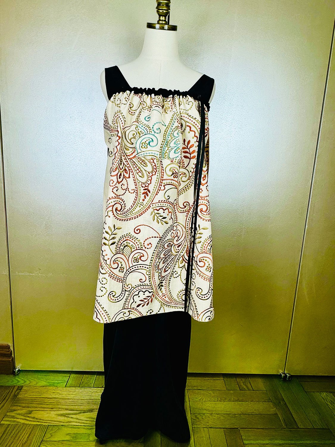 Piper skirt on mannequin shown as strapless dress front view with hoodie pocket & long ribbon detail