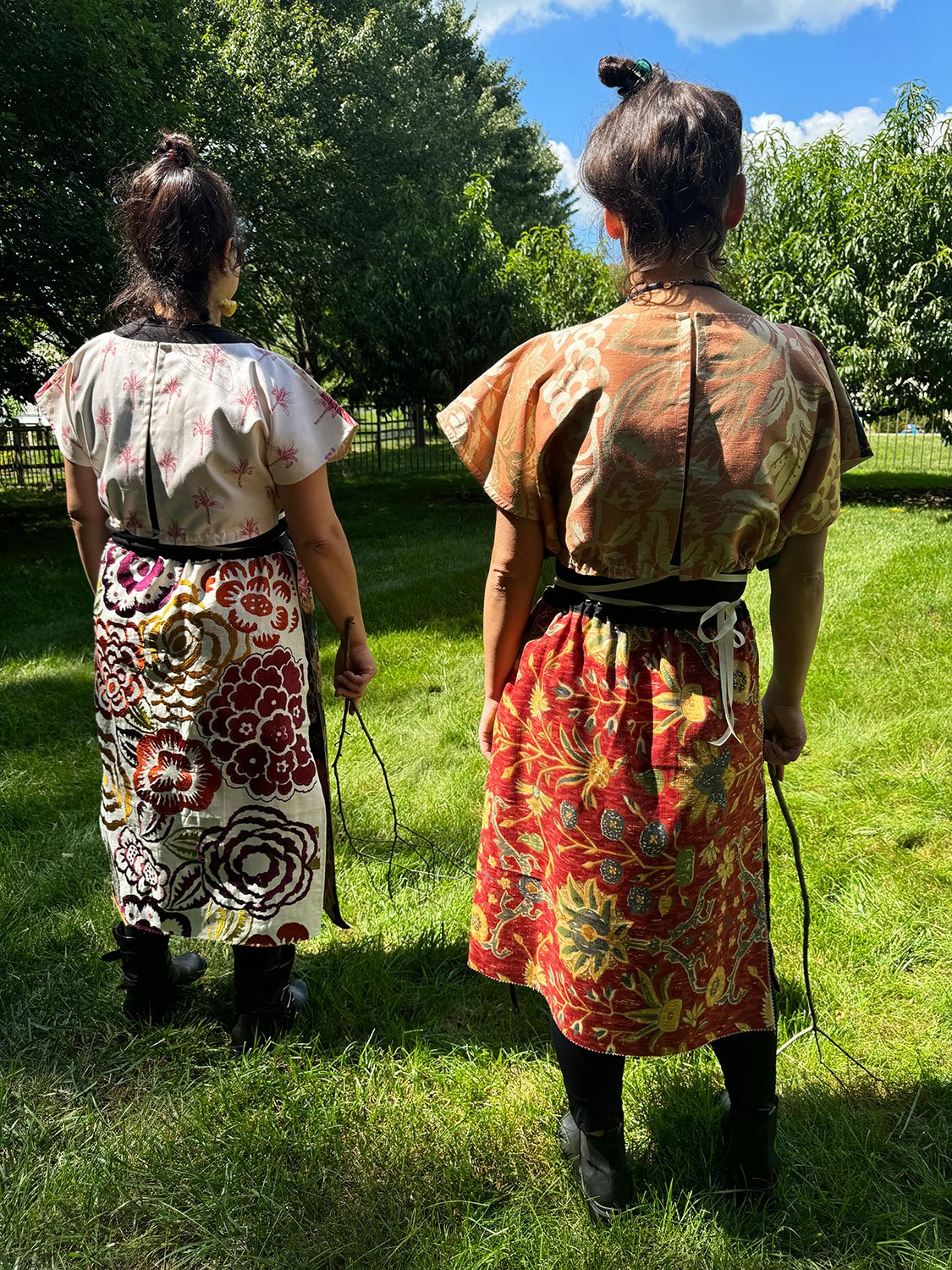 Frida Capelets with beaded antique tribal panel and Piper skirt/cape/dresses on models back view
