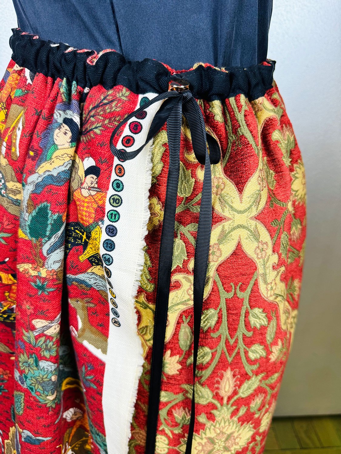 Piper skirt on mannequin side view shown up close with bow detail