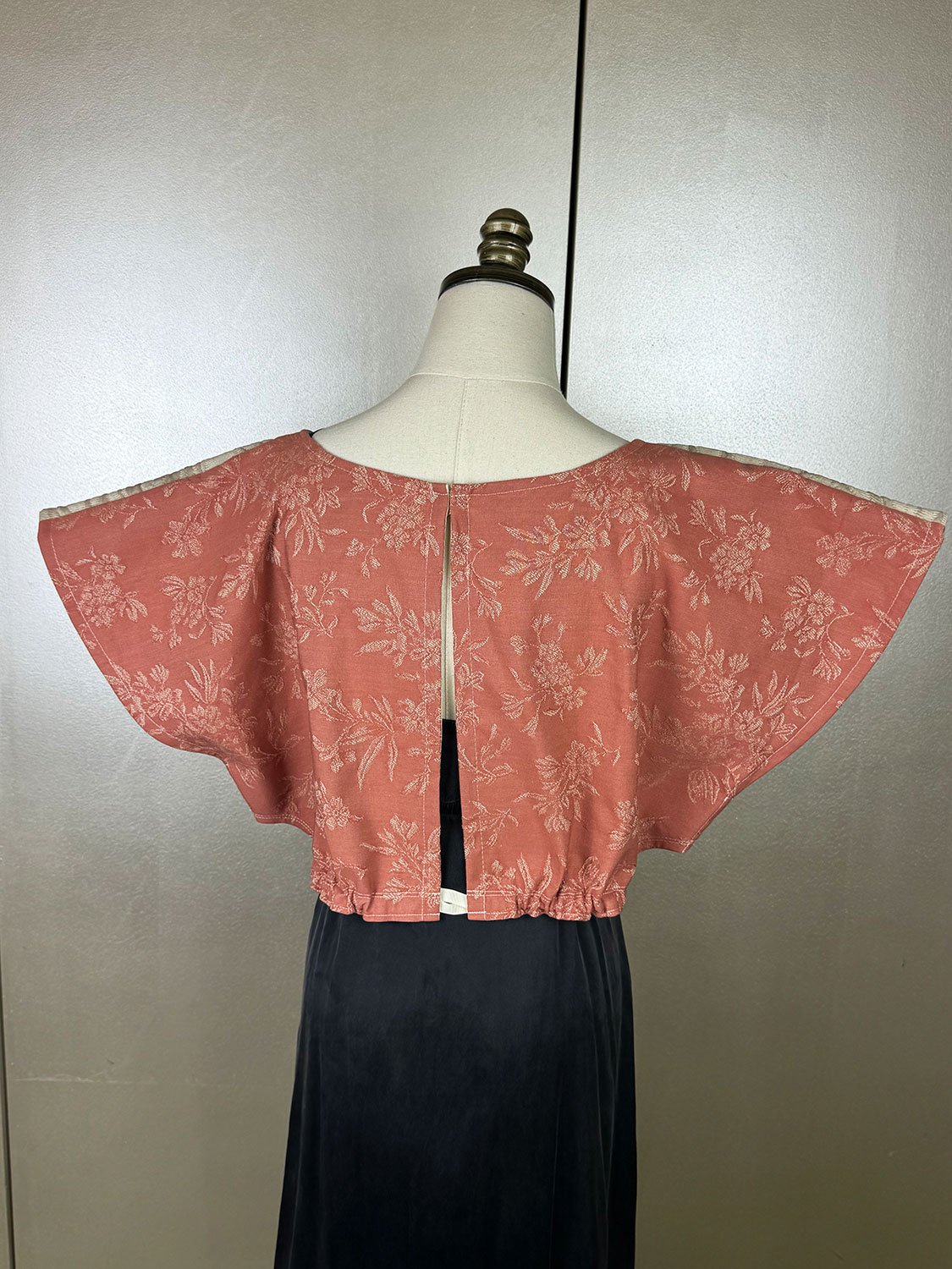 Frida Capelet back of mannequin with gros grain ribbon