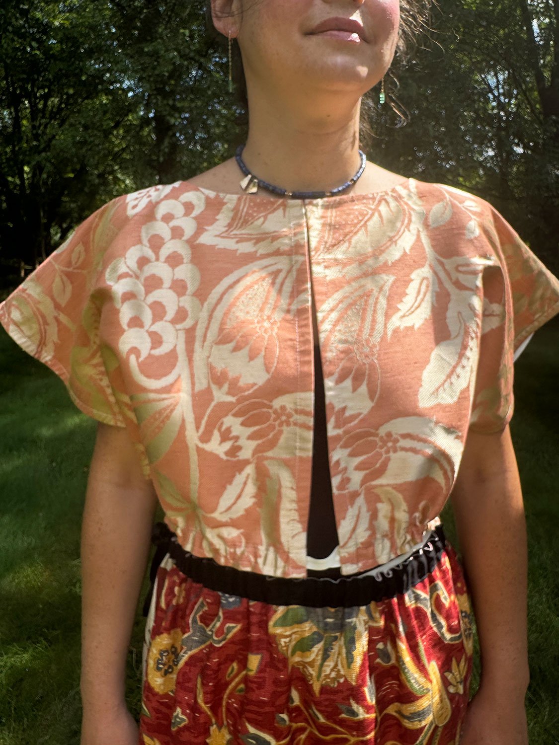 Frida Capelet shown reversed and open on model
