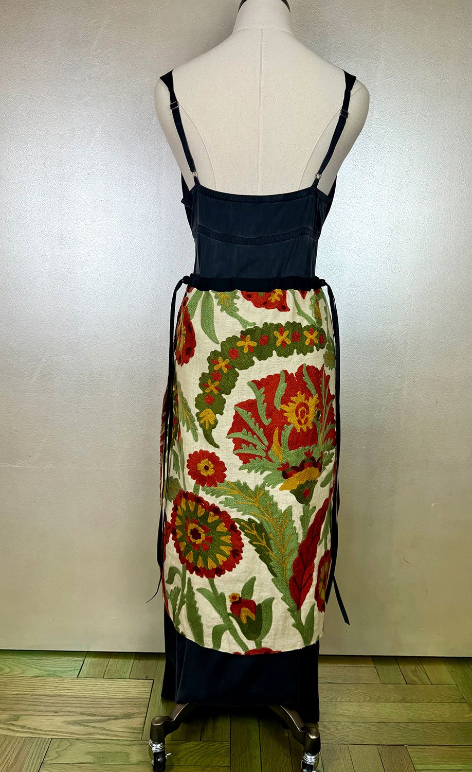 Piper overskirt on mannequin back view reversed bow detail