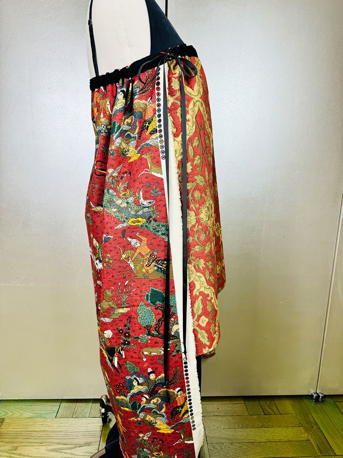 Piper skirt on mannequin shown as strapless dress side view with bow detail