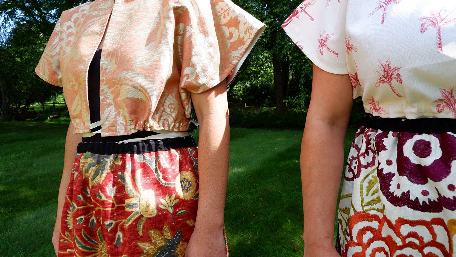 Frida Capelet worn reversed and embroidered Piper skirt/cape/dresses on models close up