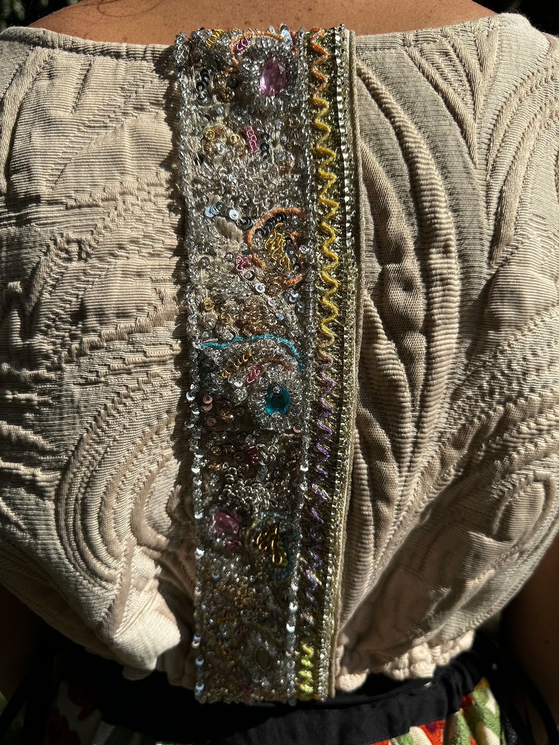 Frida Capelet with antique Sari fragment panels worn reversed on back on model details