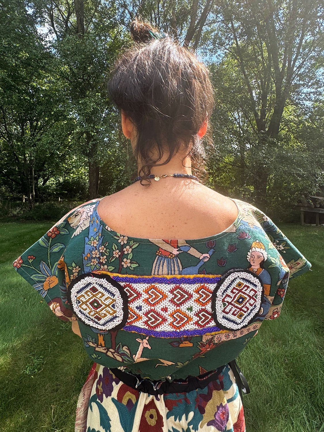Frida Capelet with beaded antique tribal panel worn on back up close