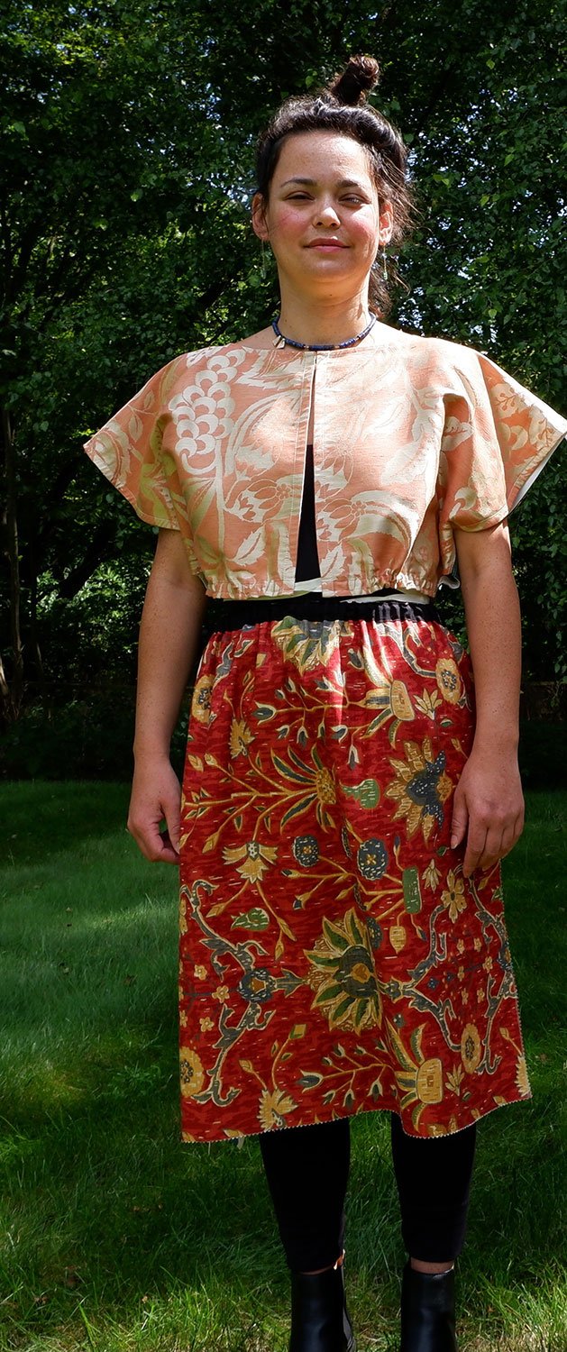 Frida Capelet shown reversed and open on model with necklace