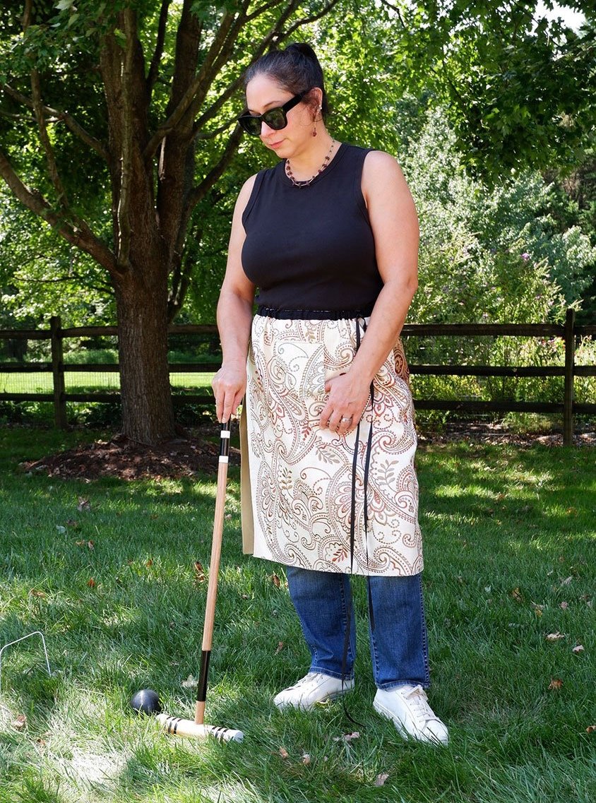 Piper overskirt with hoodie pocket on model front view skirt