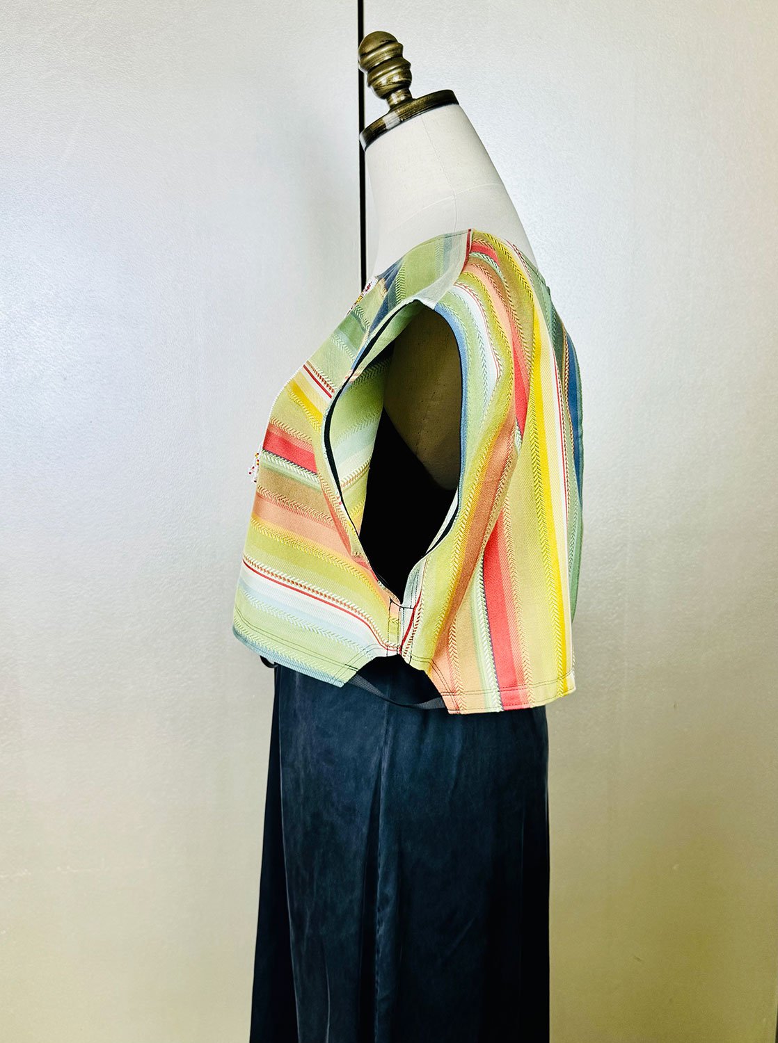 Frida Capelet side view arm hole shown on mannequin