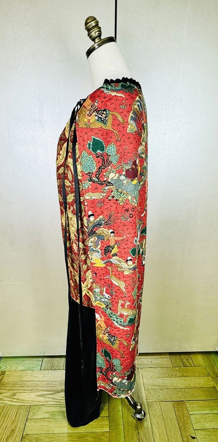 Piper overskirt on mannequin shown as cape side view with long ribbon accent