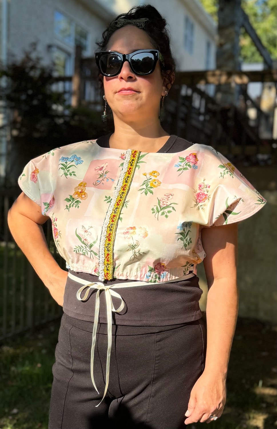 Frida Capelet pink coated chintz print and beaded tribal fragment adornment on model