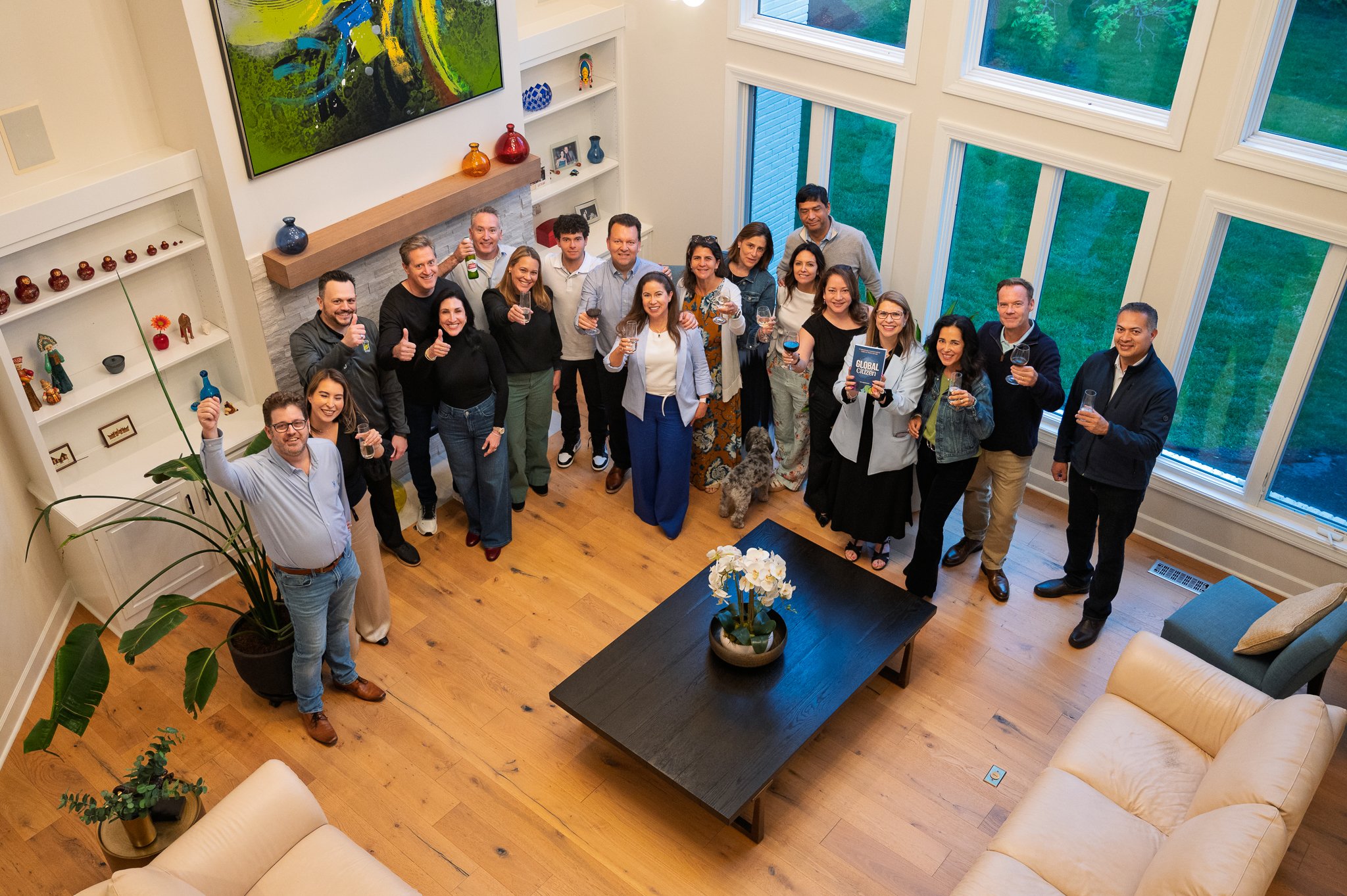 Author Toyi Rodriguez celebrates the release of her book, Global Citizen, with friends and family in her home.