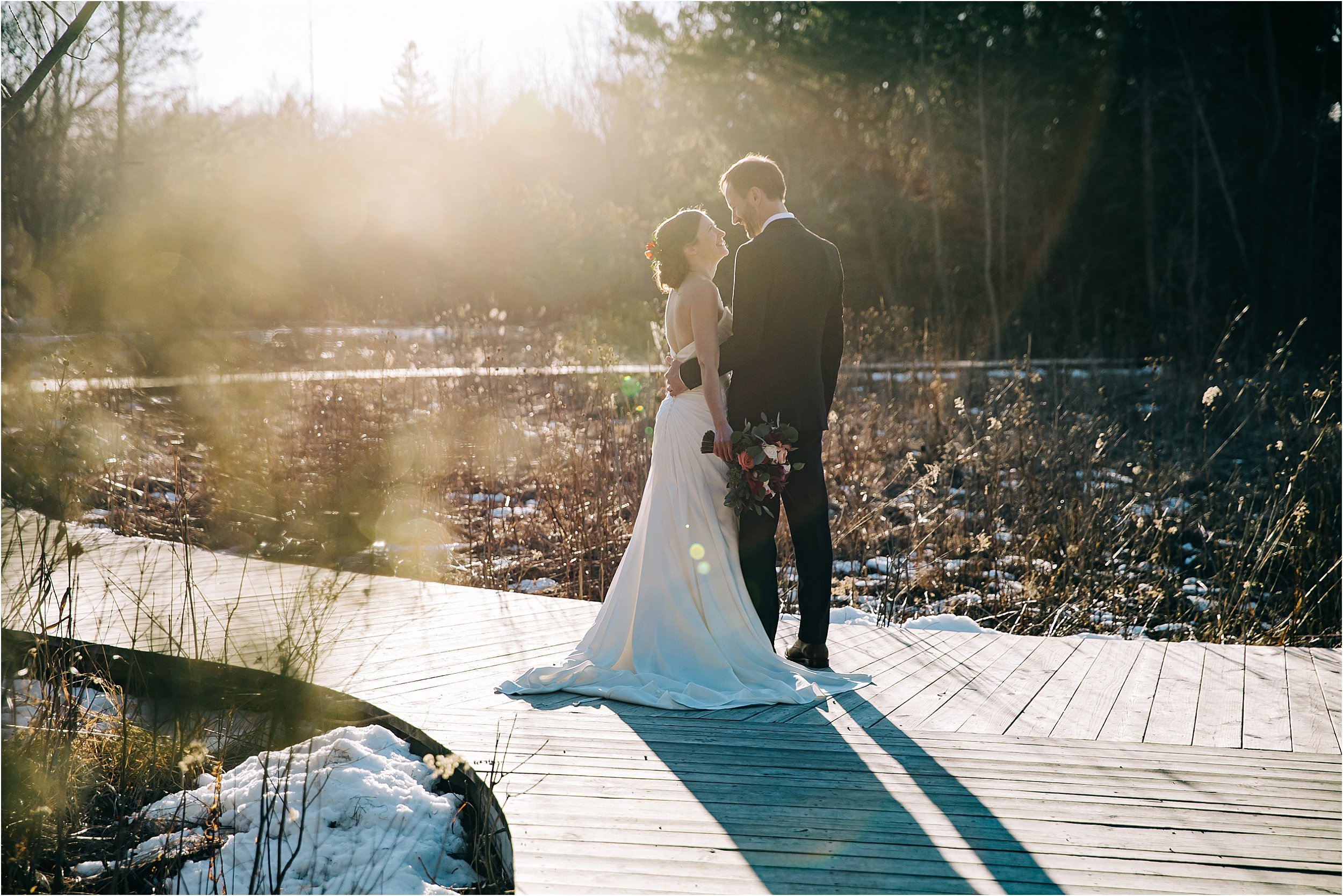 18-wood-walkway-sunflare-bride-groom.JPG