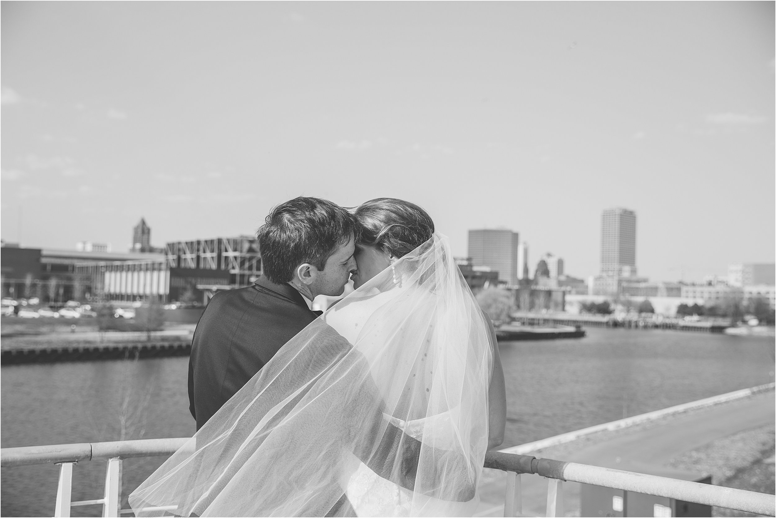 25-bride-groom-kissing-behind-veil.JPG