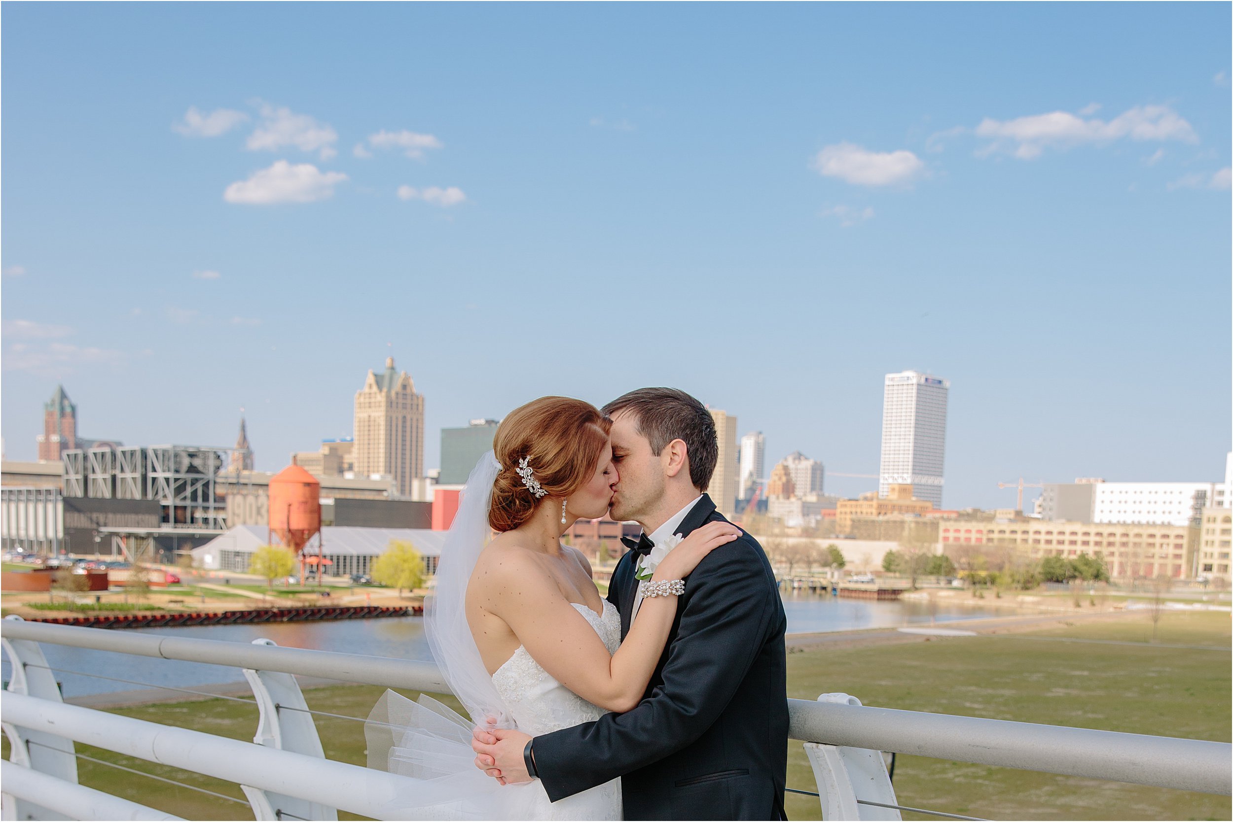 23-blue-sky-downtown-mke-skyline-bride-groom.JPG