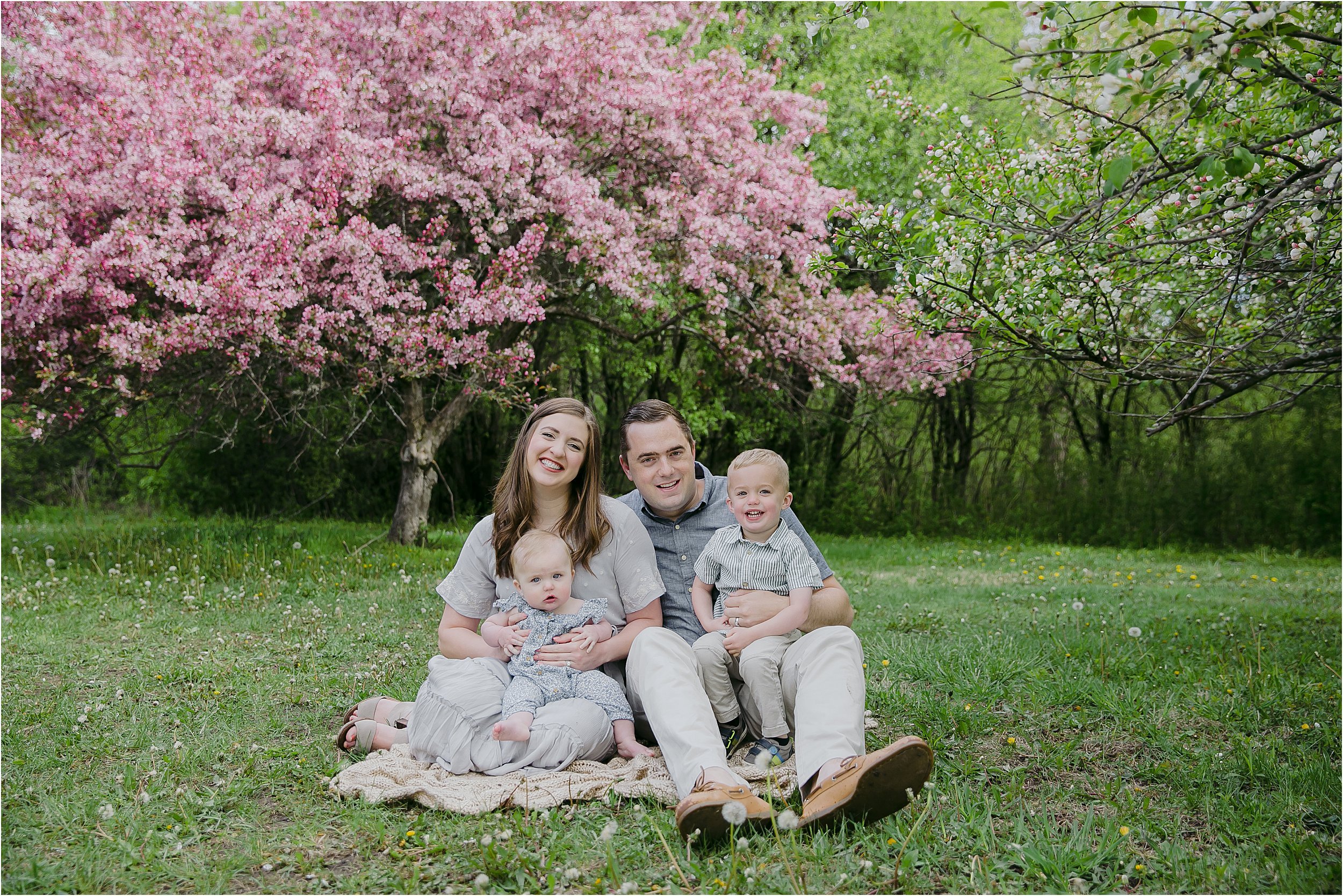 010-pink-flowering-trees-family-two-small-children-in-laps.JPG