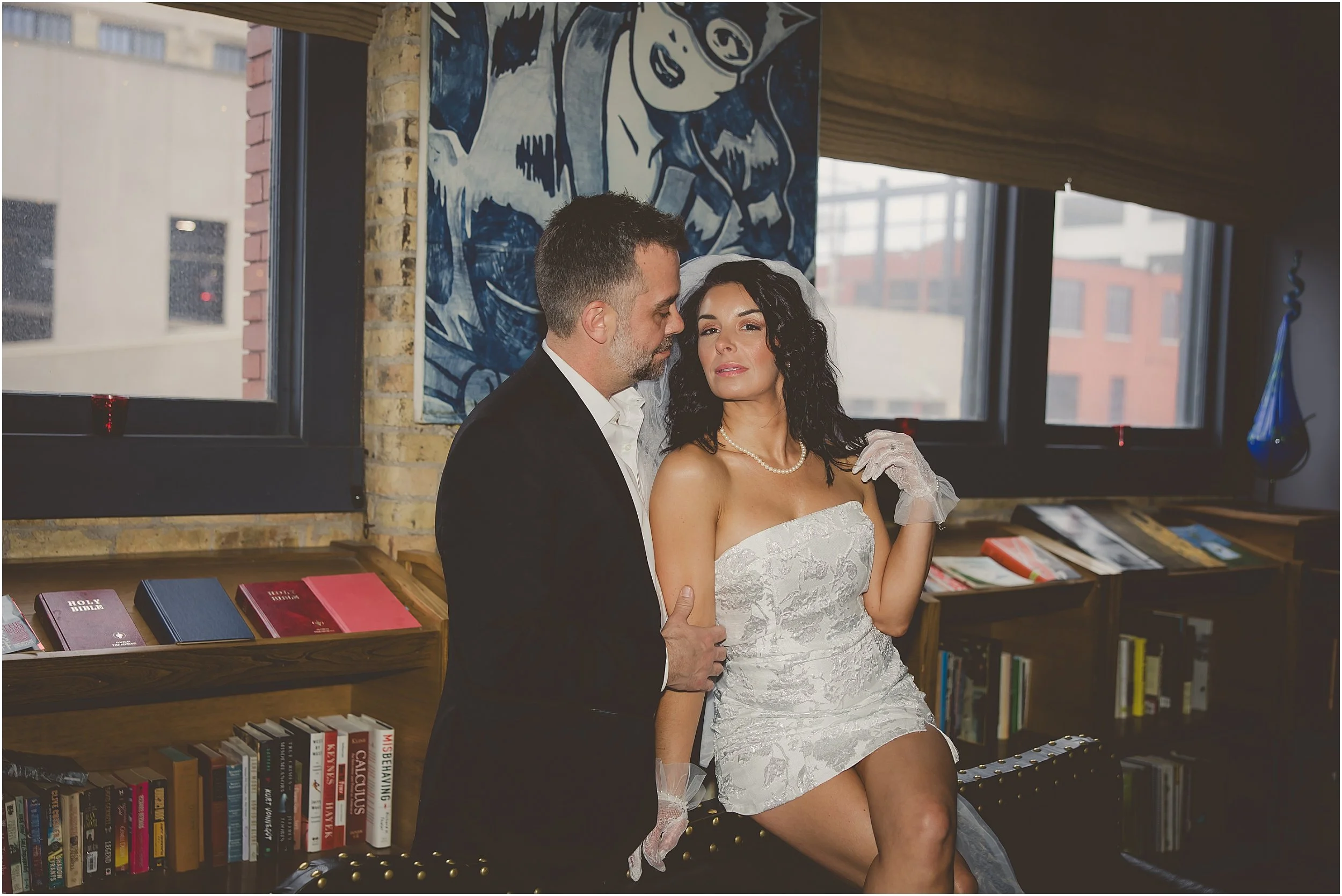 sexy-romantic-edgy-engagement-photos-iron-horse-hotel-lace-gloves-veil-big-white-bow-train-newspaper-drinks.JPG